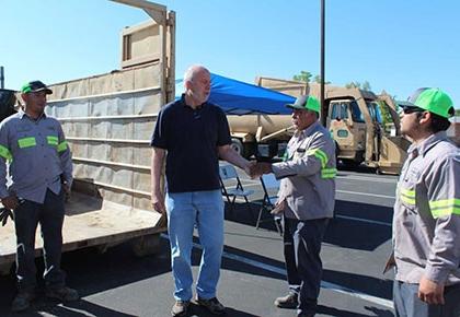 Supervisor David Couch and a resident at the Wasco community clean-up